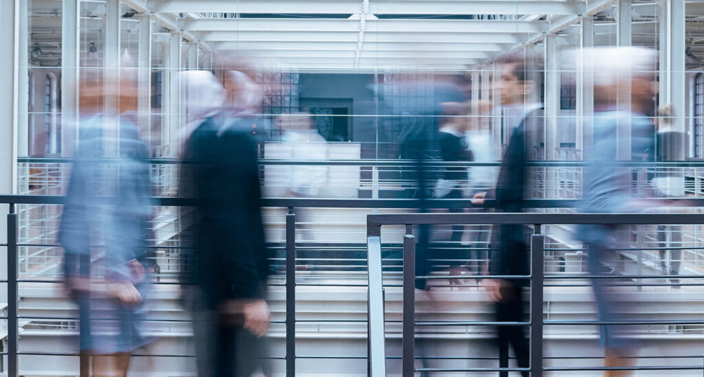 Business People Talking In Corridor PSVCLEM1 1024x549